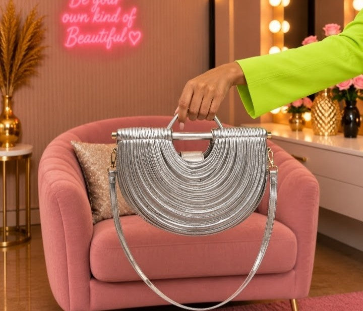 Luxury Silver Metallic Half-Moon Handbag with Layered Ribbed Design, Sculpted Handle & Shoulder Strap