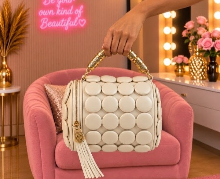 Luxury Cream White Bubble-Embossed Handbag with Gold-Tone Handle and Elegant Tassel Details