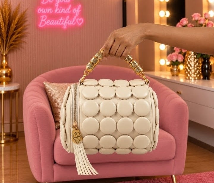 Luxury Cream White Bubble-Embossed Handbag with Gold-Tone Handle and Elegant Tassel Details