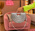 Luxury Silver Metallic Half-Moon Handbag with Layered Ribbed Design, Sculpted Handle & Shoulder Strap
